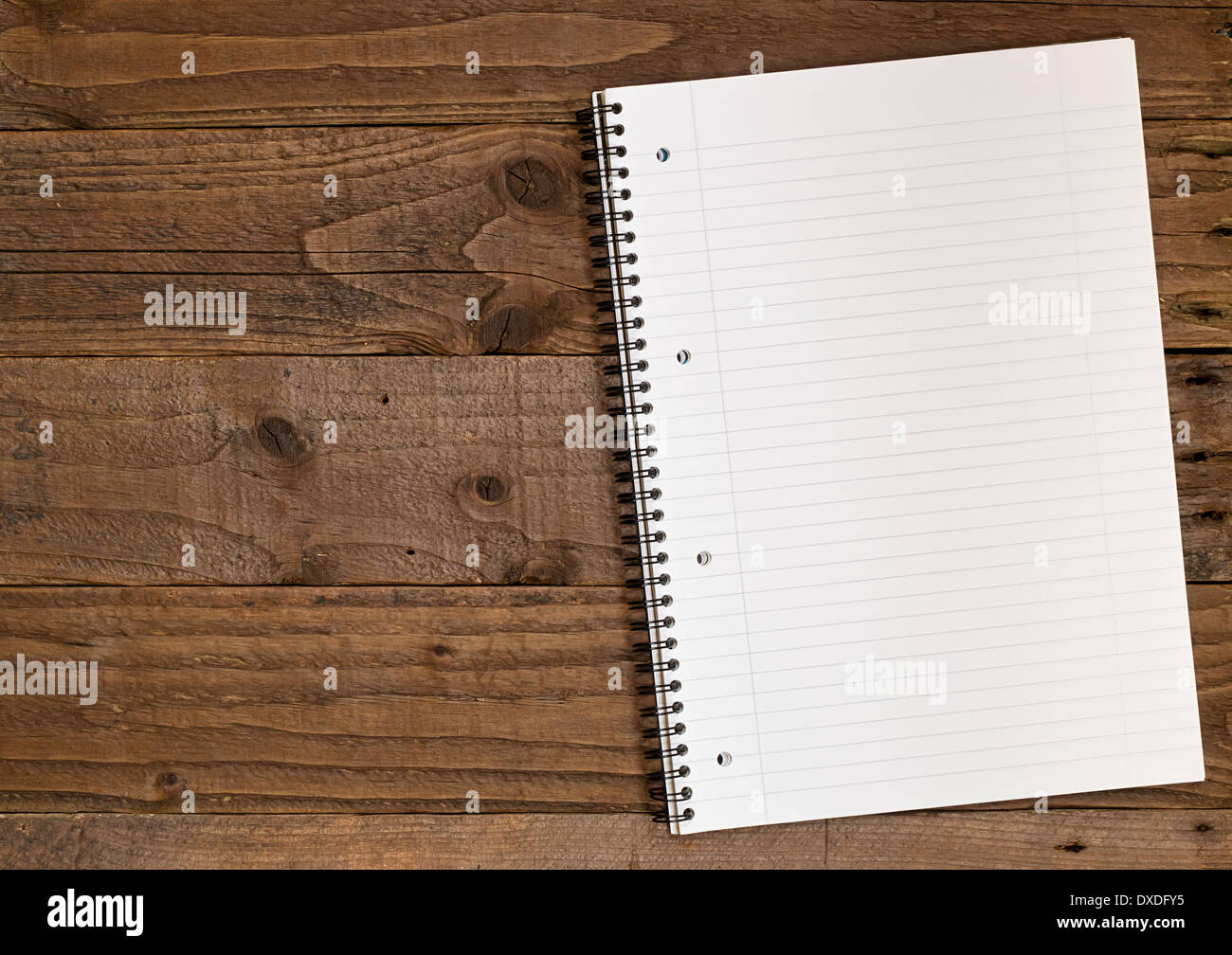 Blank lined notepad, A4 size with space on the left for insertion of your own design elements. Stock Photo