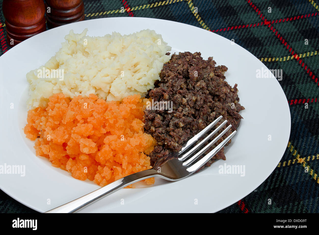 Traditional Scottish haggis, neeps and tatties also known as a burns supper. Stock Photo