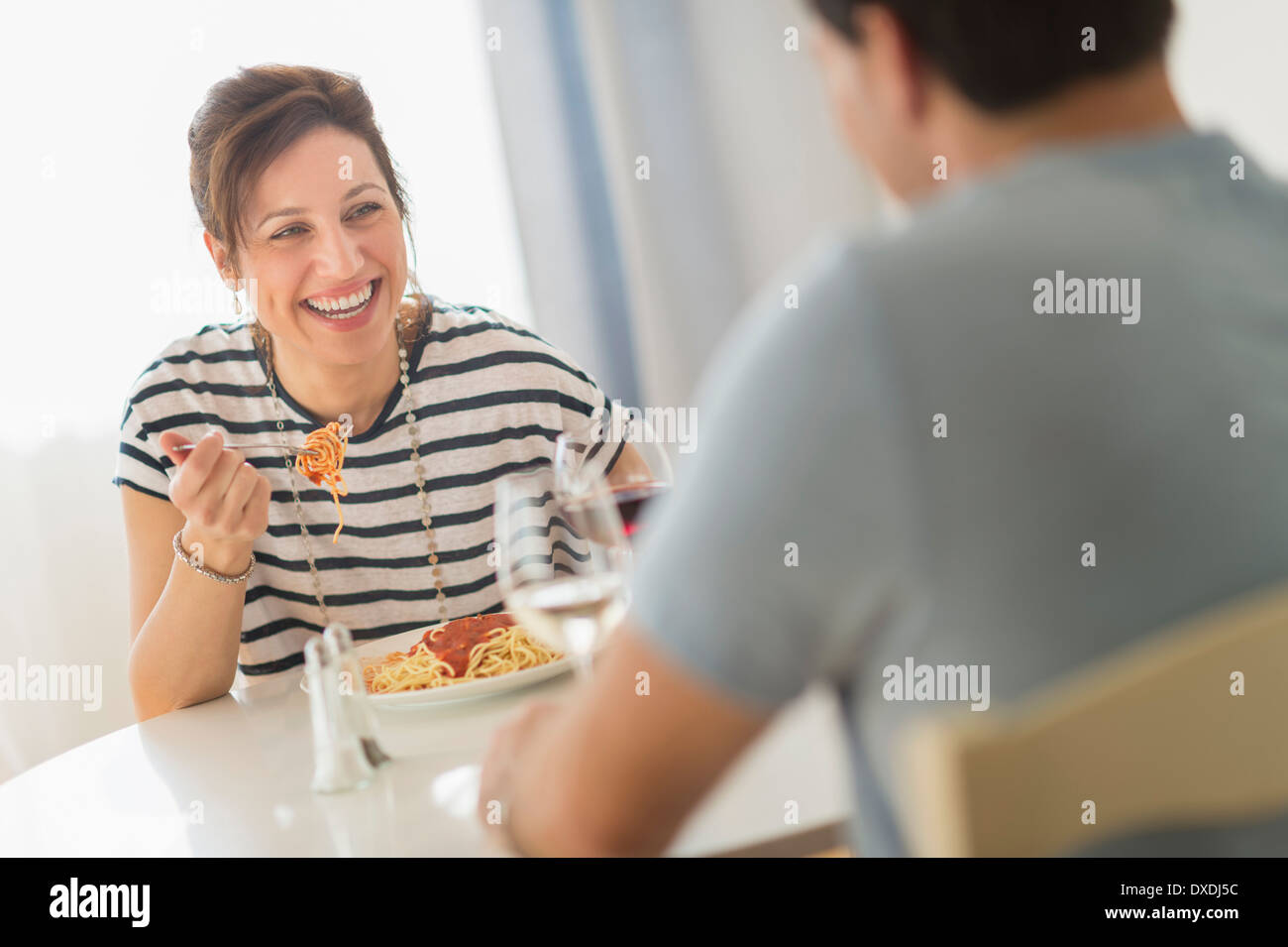 Couple eating spaghetti Stock Photo