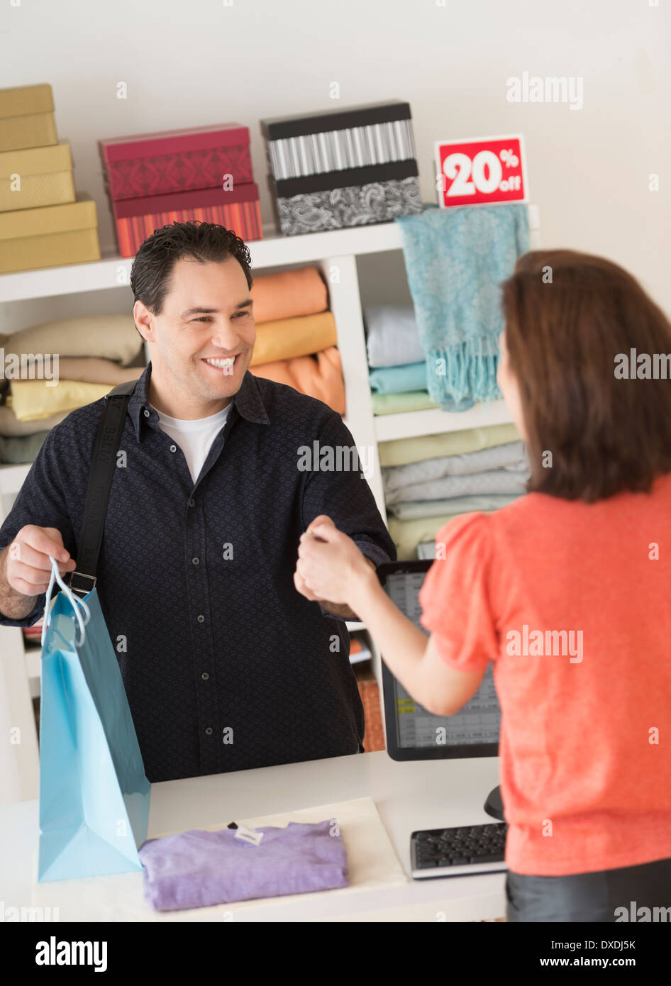Customer paying in clothes store Stock Photo