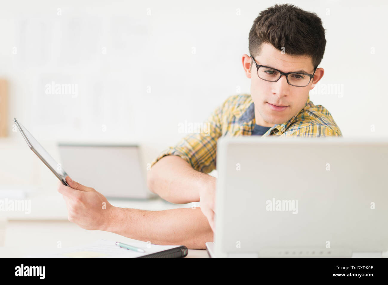 Young man using tablet Stock Photo