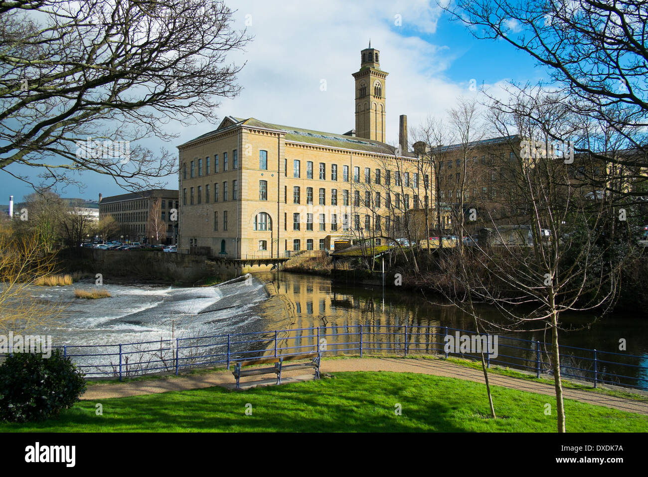Salts Mill and the river Aire, Saltaire, Bradford, Yorkshire, England Stock Photo