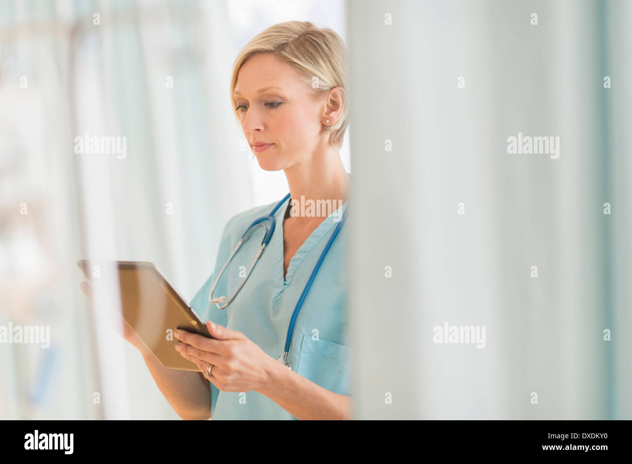 Female doctor using tablet PC Stock Photo