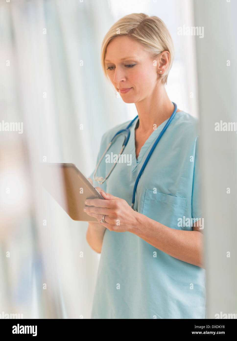 Female nurse using tablet PC Stock Photo