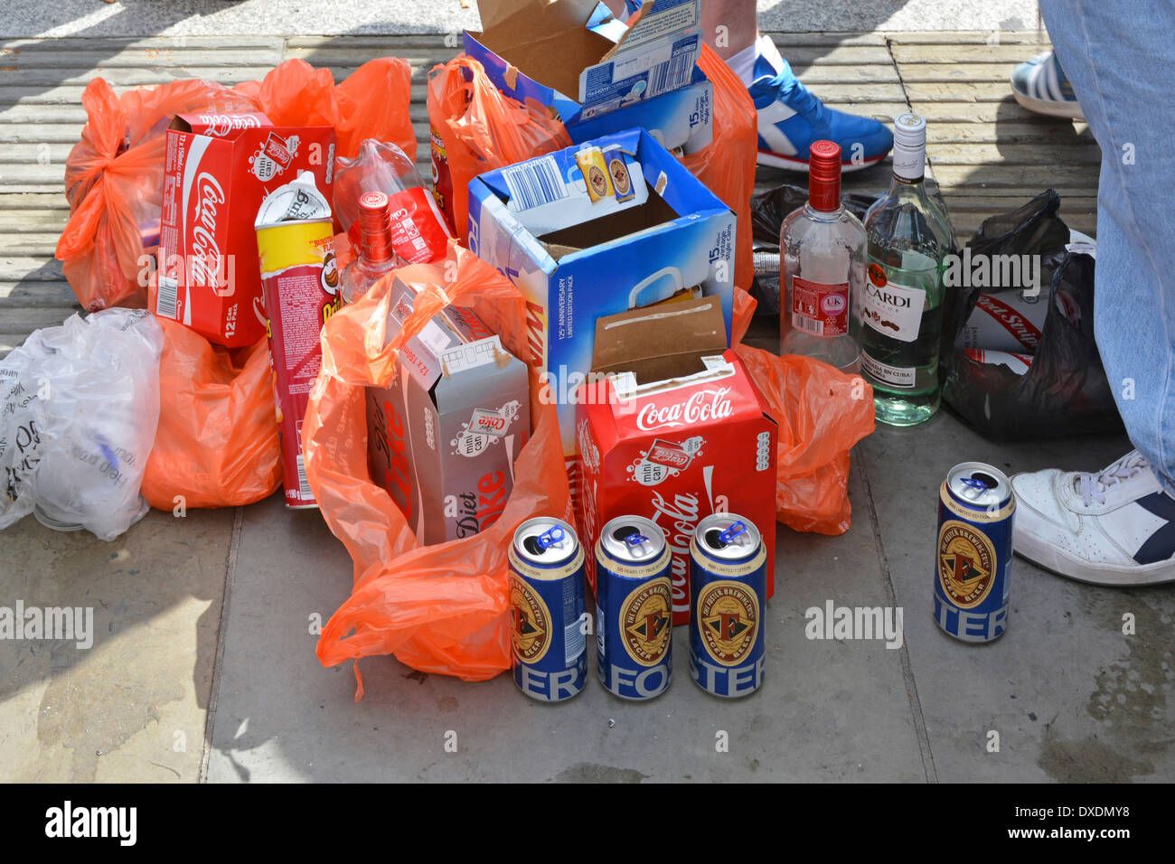 Selection of soft drinks & alcohol around feet of Scotland football fans prior to a match at Wembley Stock Photo