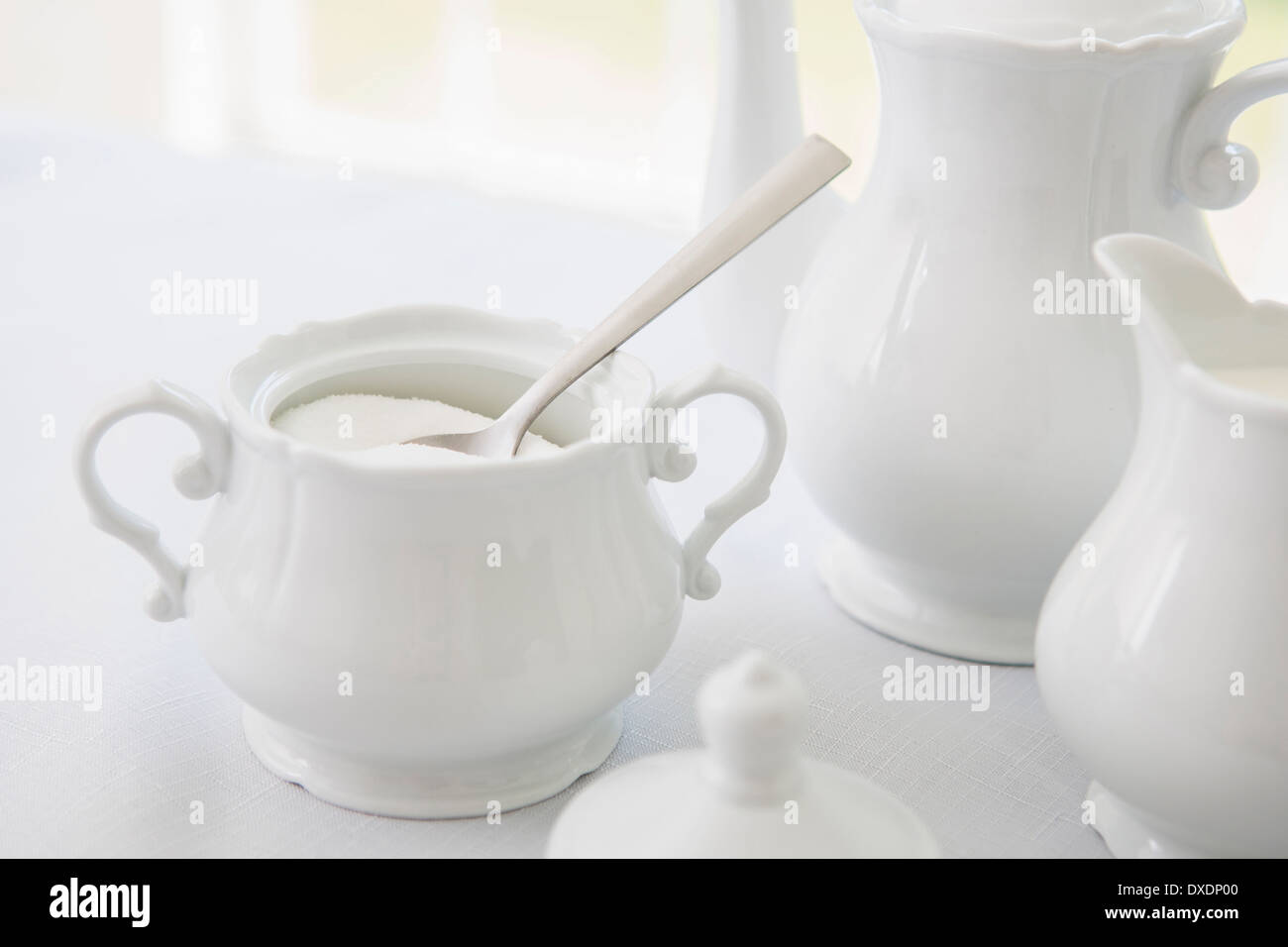 White porcelain sugar bowl with teapot and creamer, tea service, studio shot Stock Photo