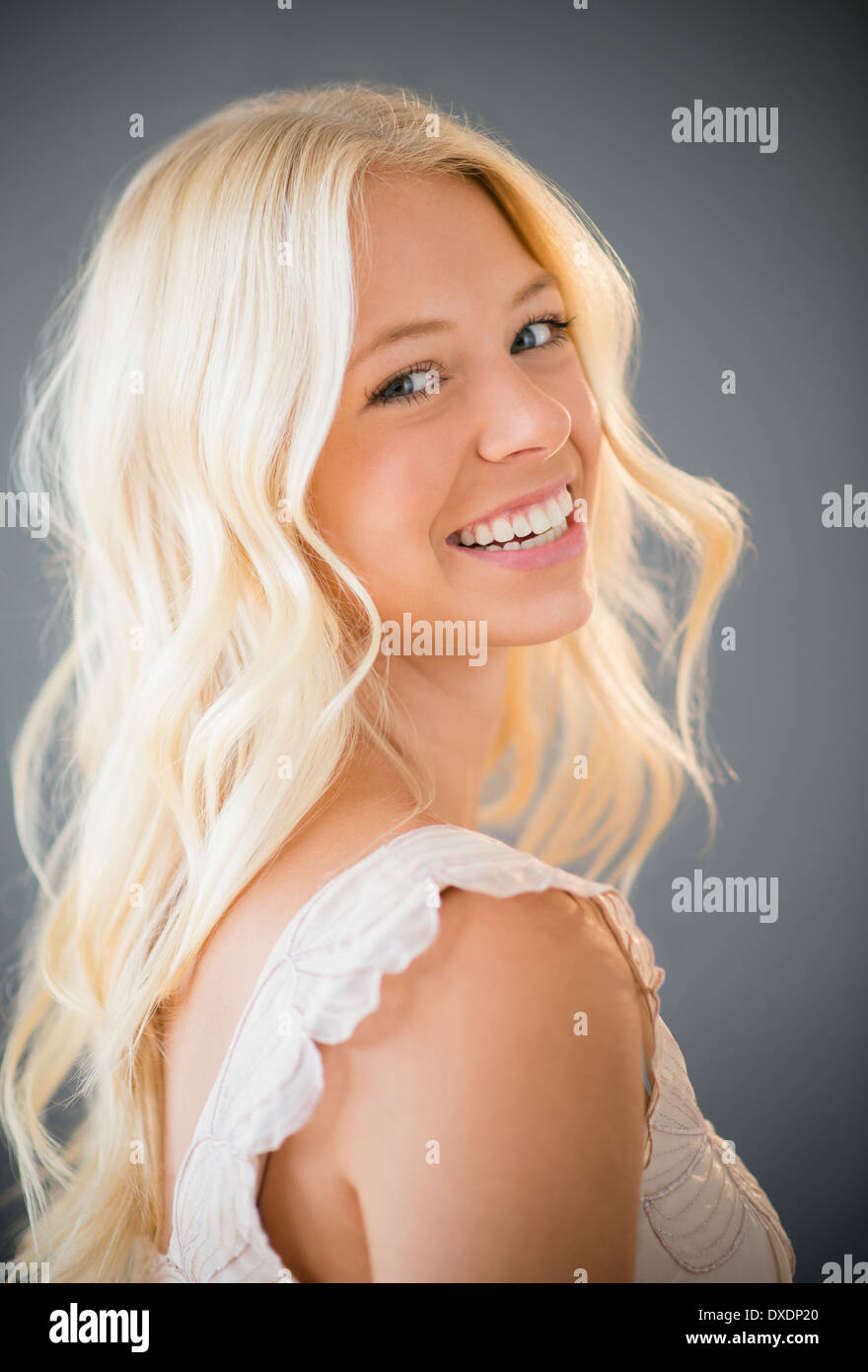 Portrait of young woman smiling Stock Photo