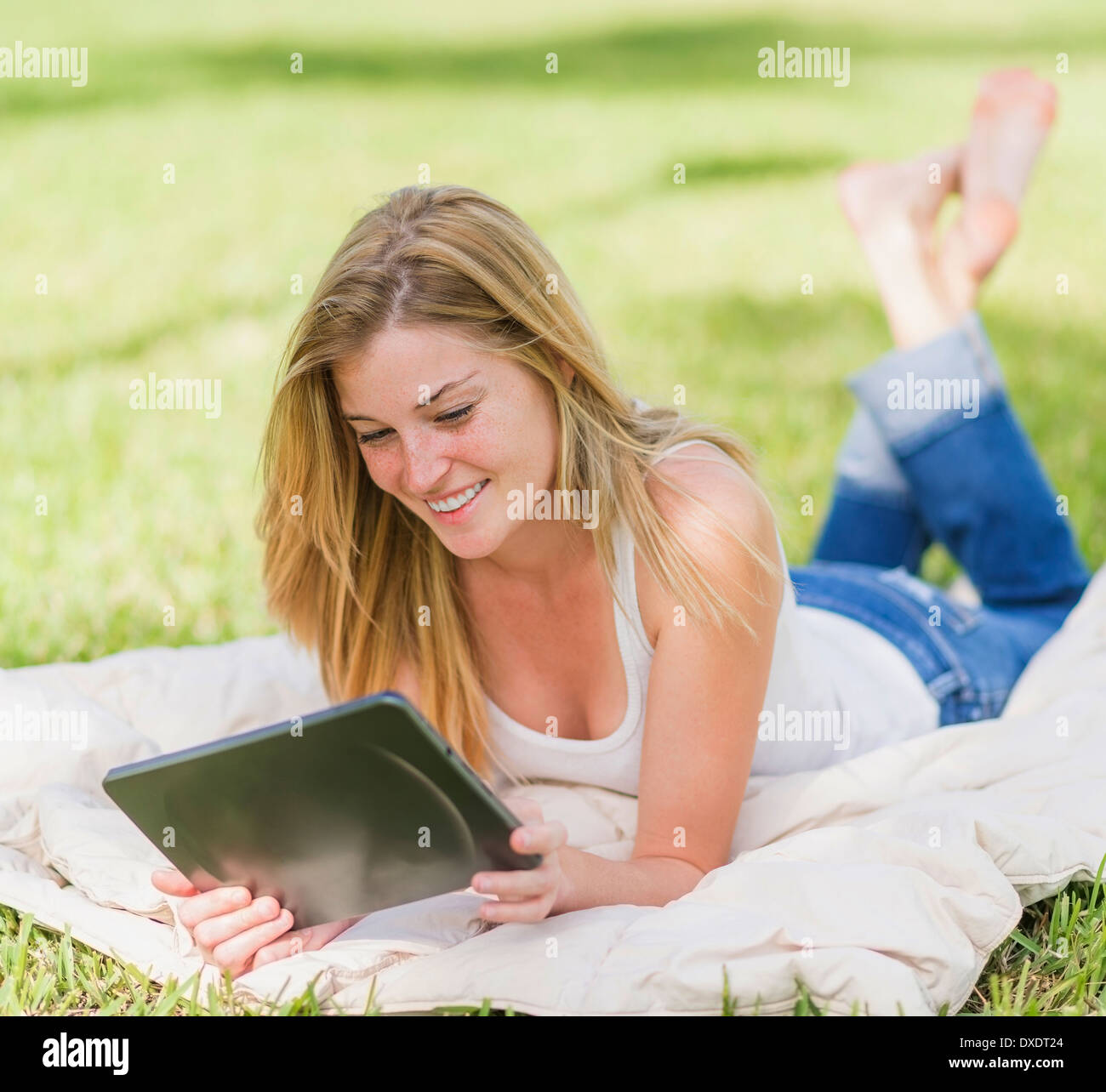 Young woman using digital tablet Stock Photo
