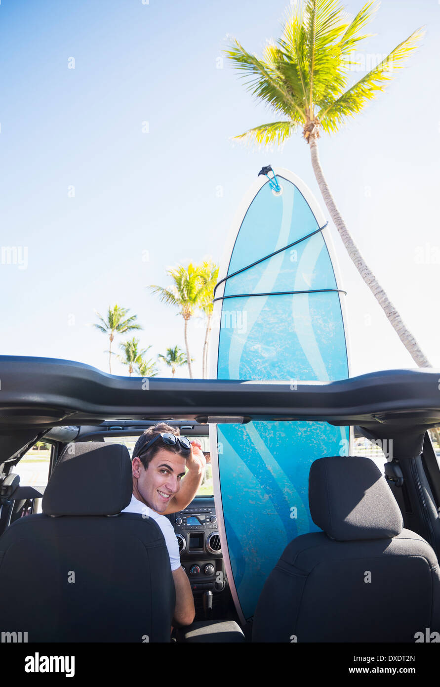 Young man sitting inside car, Jupiter, Florida, USA Stock Photo