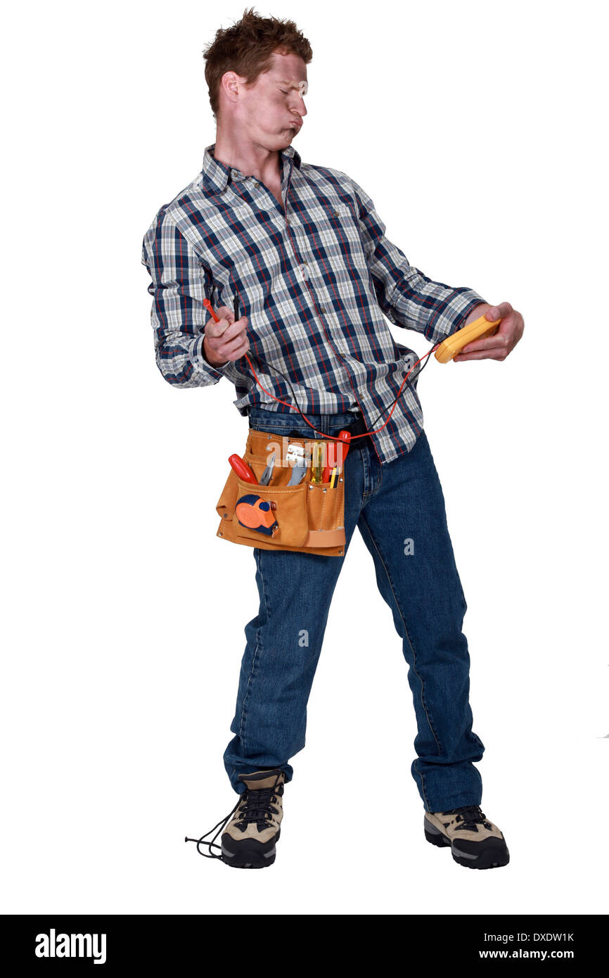 electrician holding a measurement tool Stock Photo Alamy