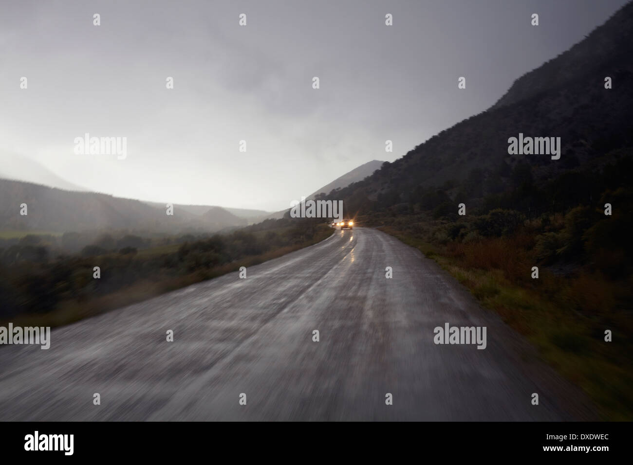 Car lights on wet, foggy, mountain road, Colorado, USA Stock Photo Alamy