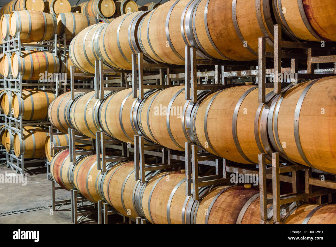 wooden,wine barrels on a storage rack Stock Photo Alamy
