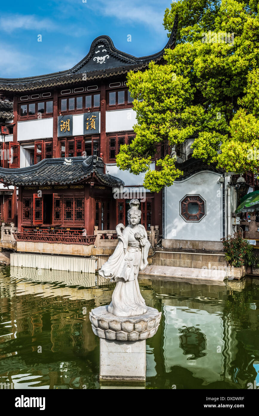 ancient statue on a pond in Fang Bang Zhong Lu old city Shanghai China Stock Photo