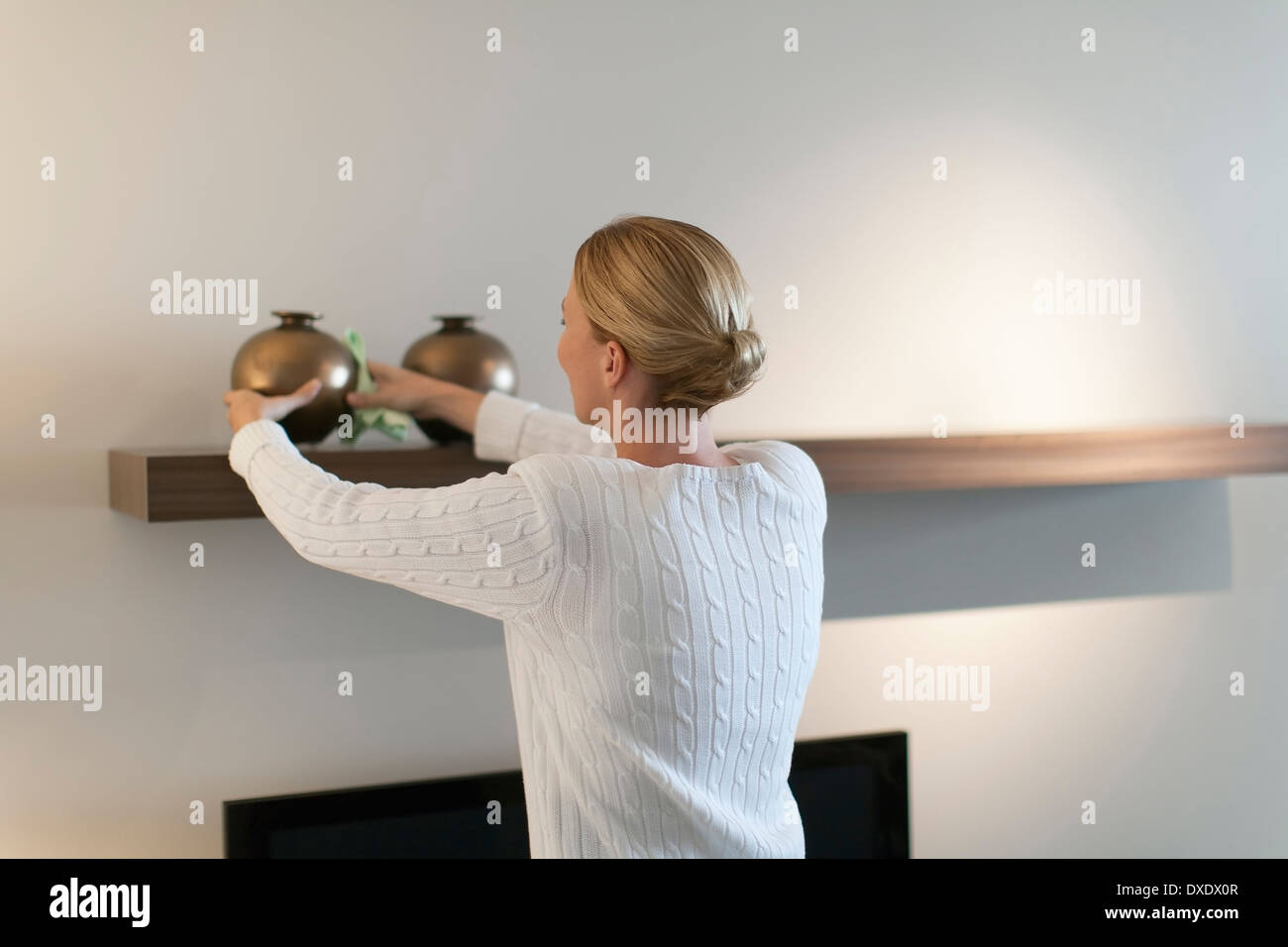 Woman cleaning house Stock Photo