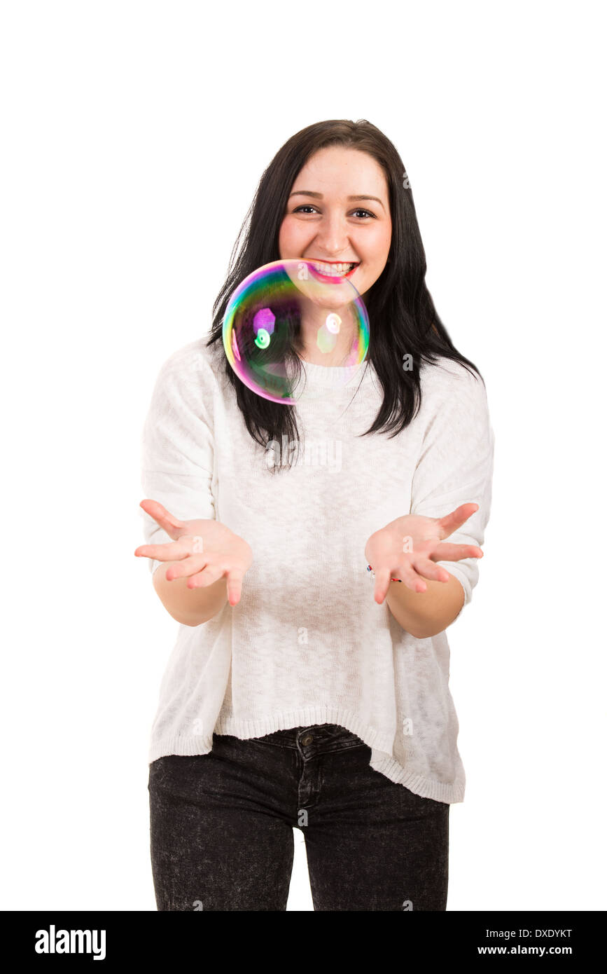 Laughing woman catching big soap bubble isolated on white background Stock Photo