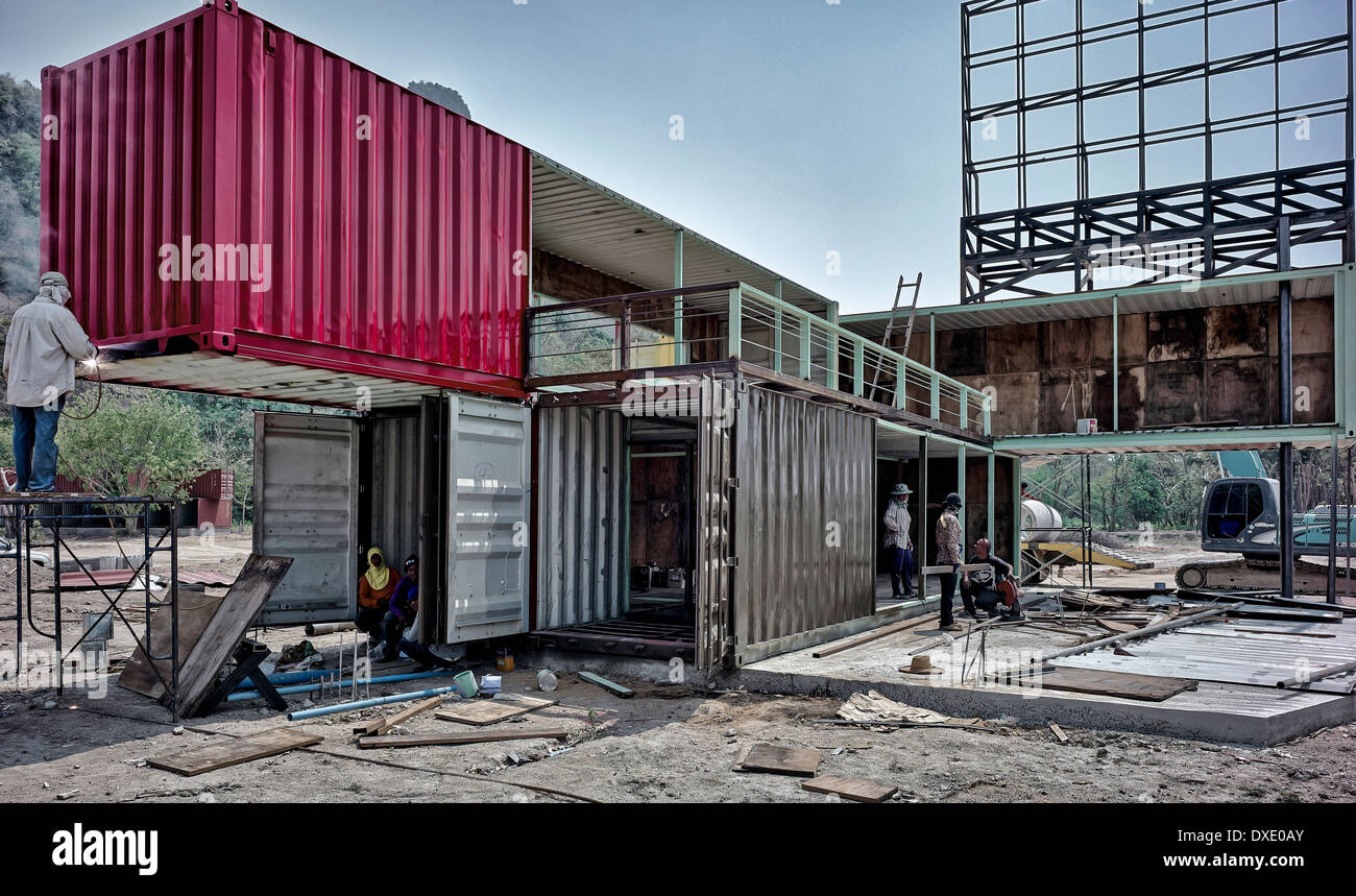 Unusual home exterior. Container house. Large metal shipping containers in the course of conversion to unusual residential homes. Thailand S. E. Asia Stock Photo