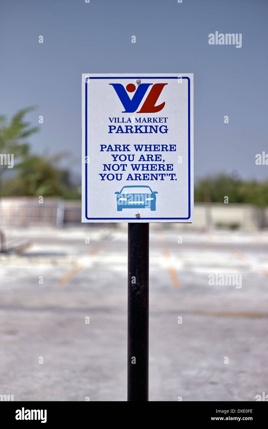 Misspelled and confusing parking sign in an empty car lot. Thailand S. E. Asia Stock Photo