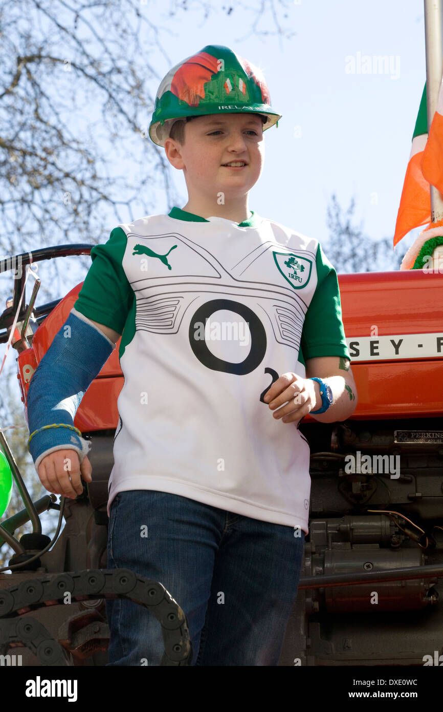 Boy in an Arm Cast at the Traditional St Patrick's Day Parade in London England Stock Photo