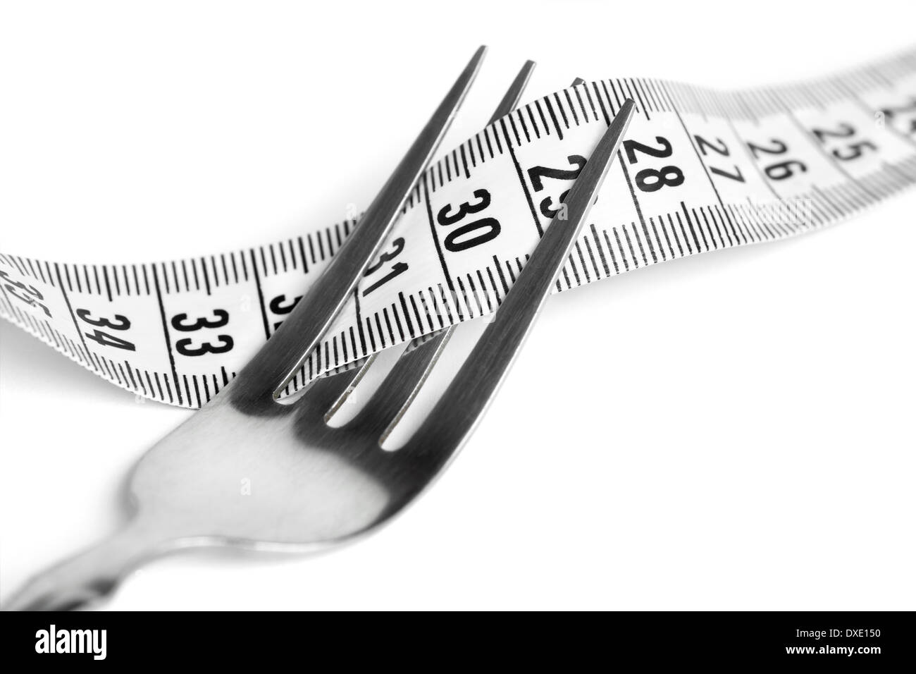 Fork with measuring tape. Diet concept Stock Photo