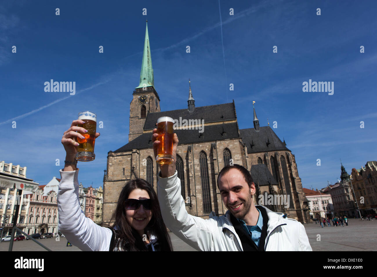 City of beer - Plzen people, couple with a beer, Pilsen Czech Republic tourists cheers Stock Photo