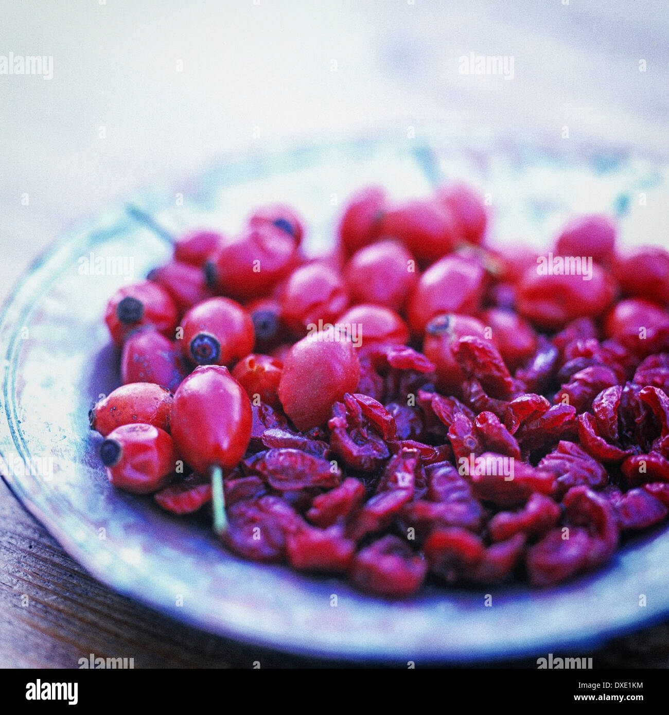 Dried cranberries and rose hips Stock Photo - Alamy