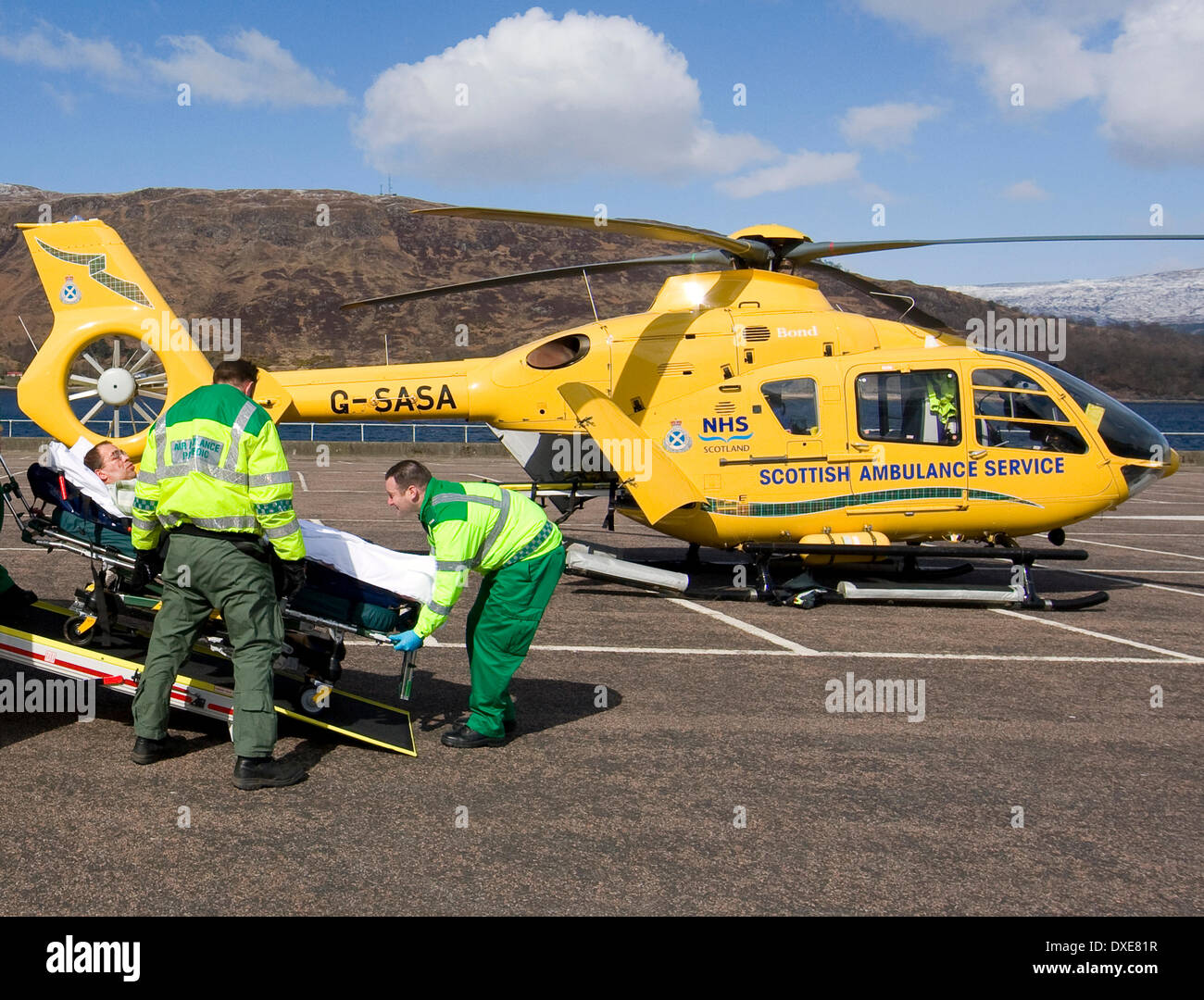The Air Ambulance crew receive a patient at Fort William, Lochaber. Stock Photo
