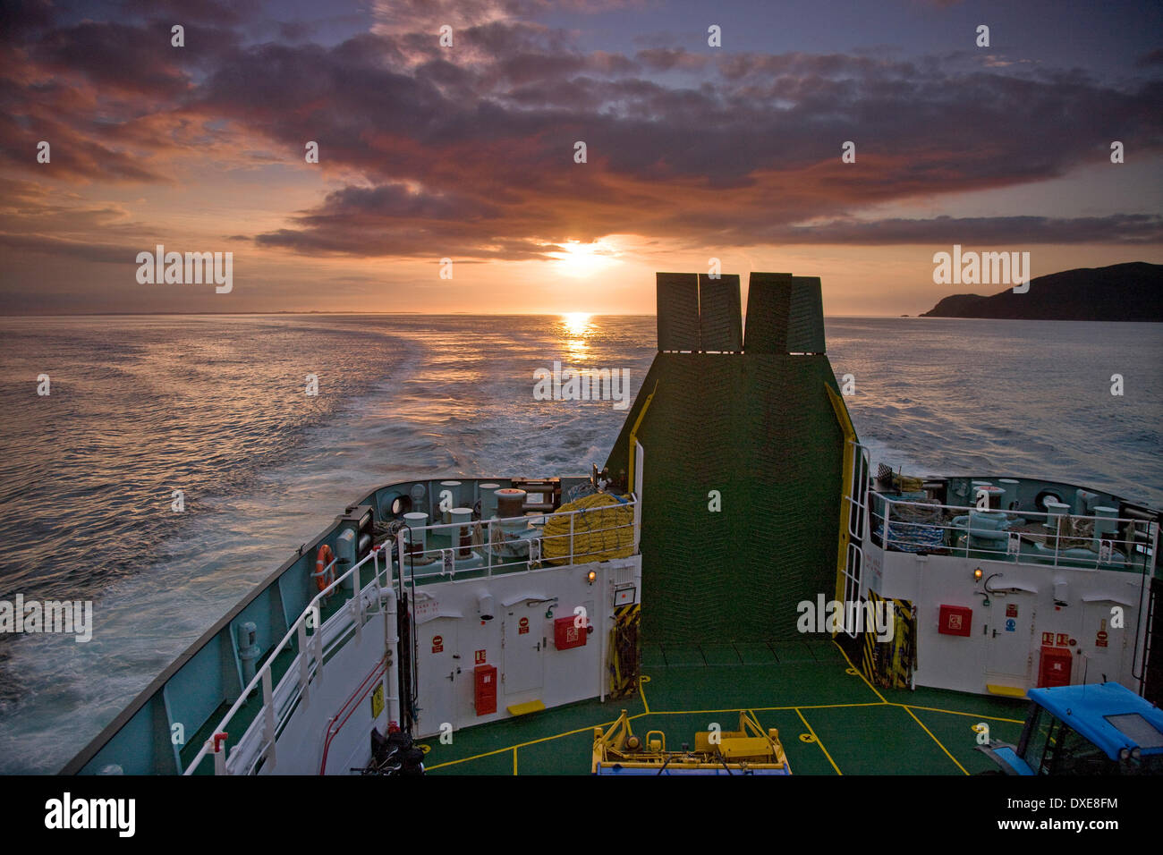 Sunset from ferry shortly after departing the Isle of Coll Stock Photo
