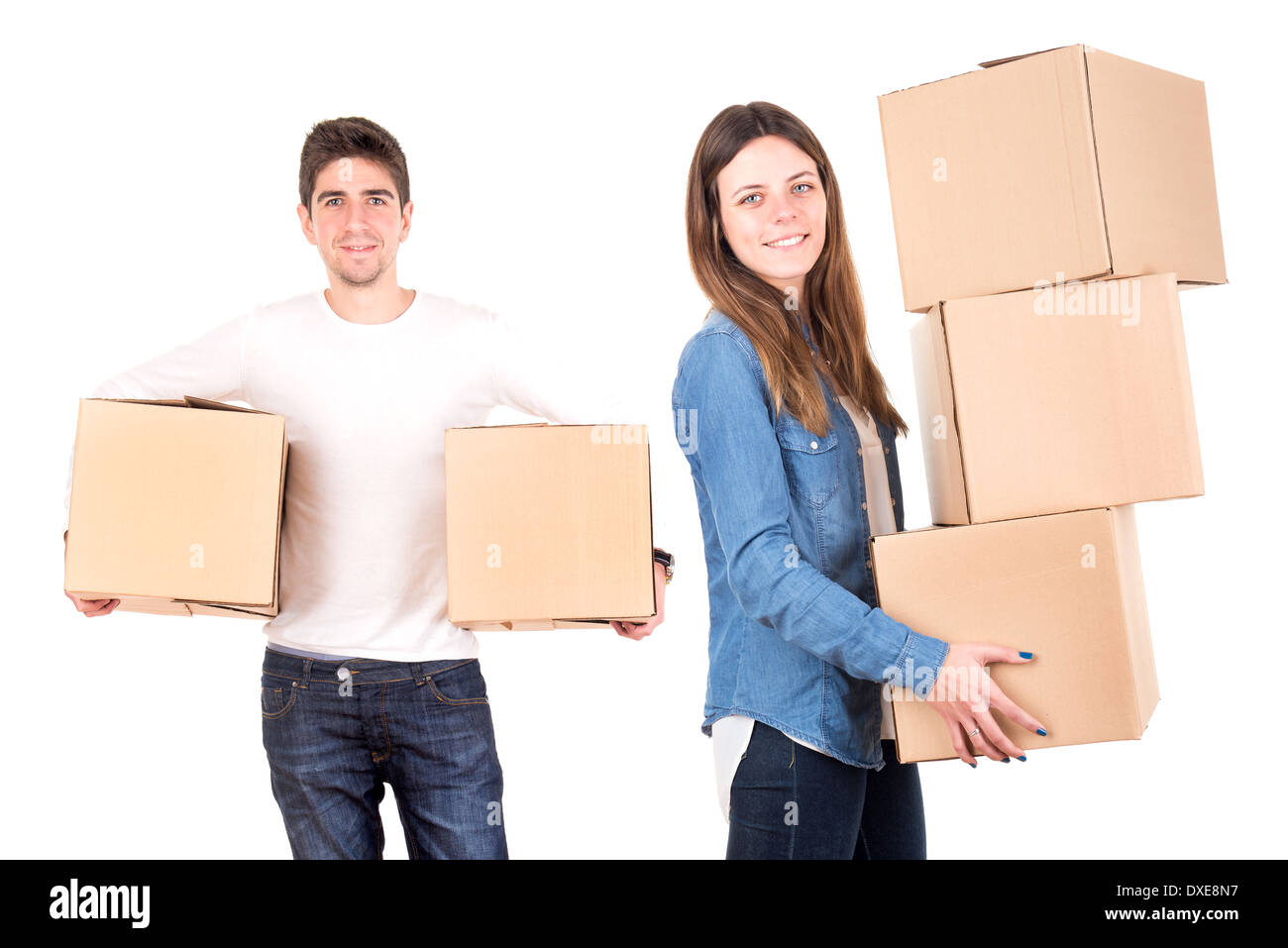 Happy couple with boxes moving into new home apartment Stock Photo