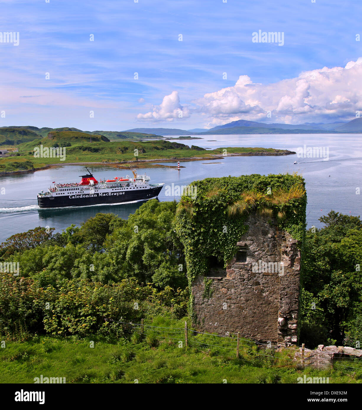 The M.V.Isle of Mull passes the ruins of Dunollie Castle, Oban, Argyll Stock Photo