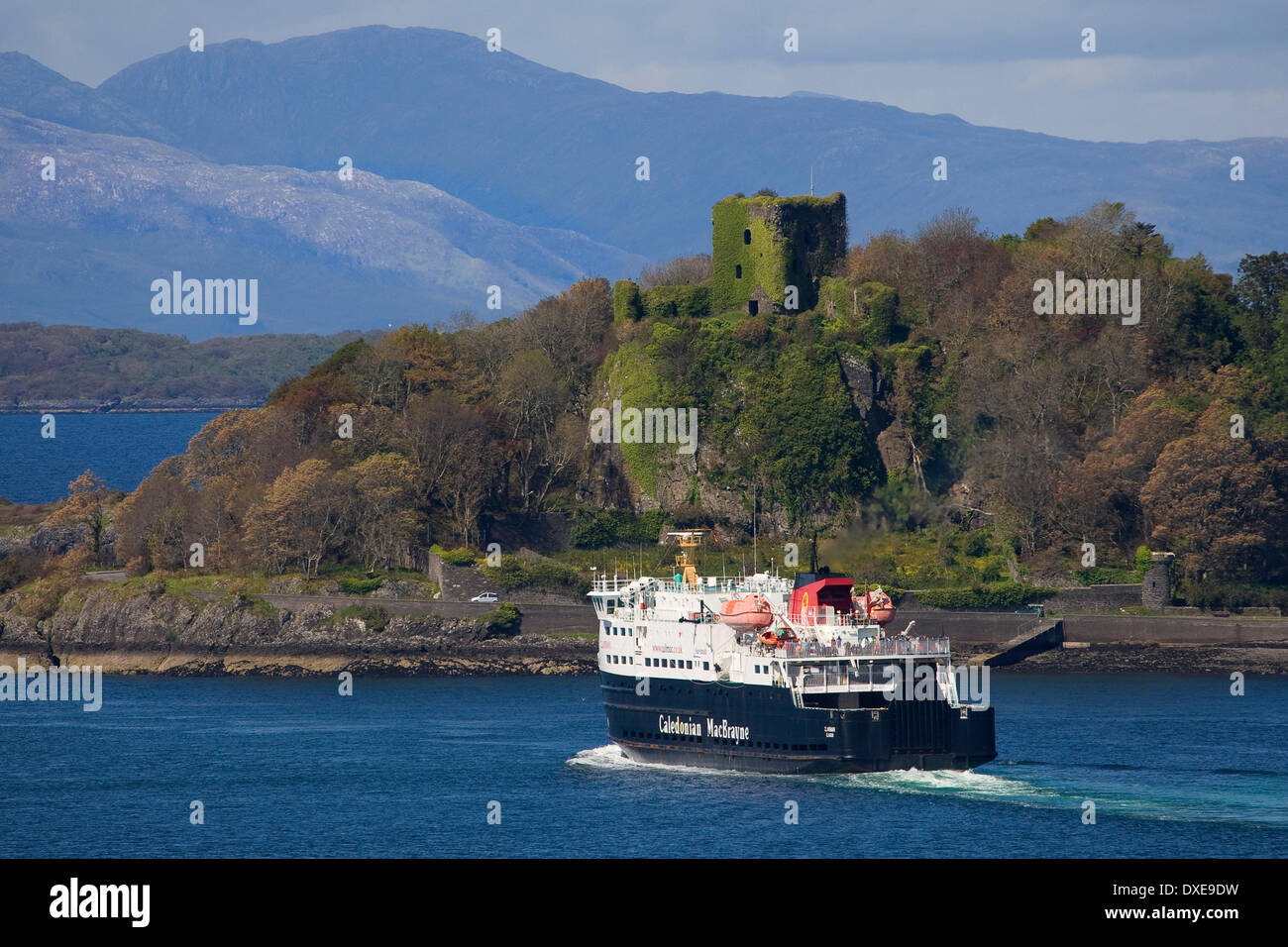 Telephoto of a departing MV Clansman with Dunollie Castle in view, Argyll. Stock Photo