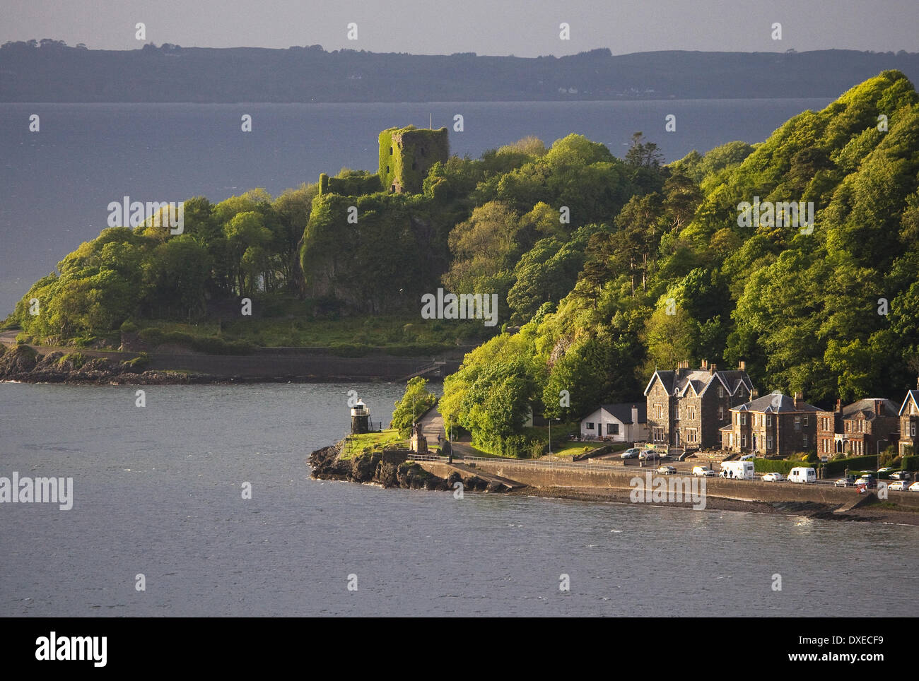 Dramatic lighting over Dunollie castle ruins Oban with the island of Lismore in distance.Argyll Stock Photo