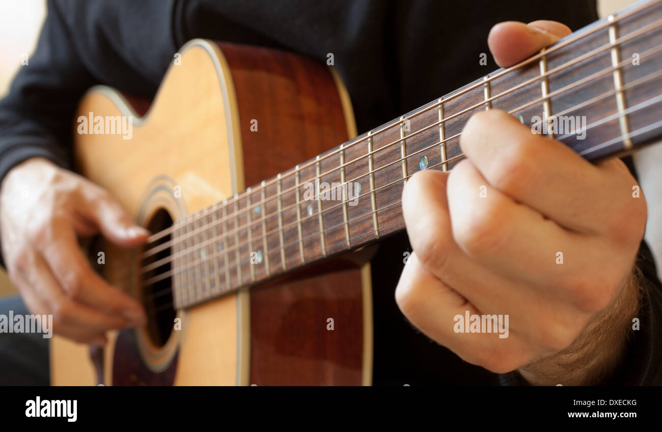 Person playing the guitar Stock Photo