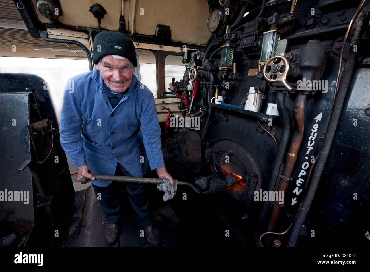 Fireman 'John Cameron' on the footplate of the great Marquess, Argyll. Stock Photo