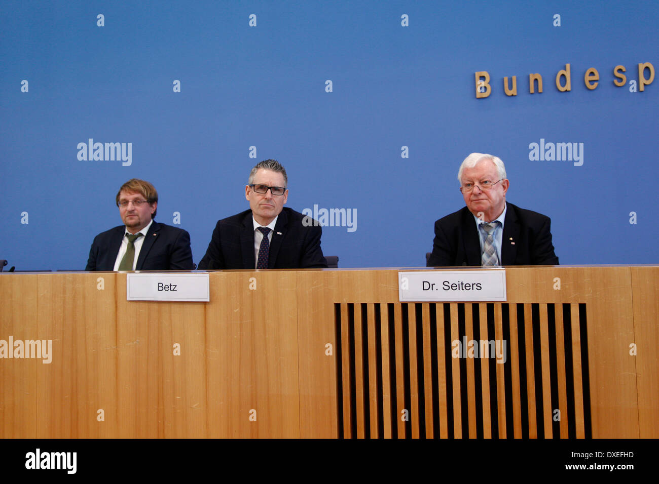 Berlin, Germany. March 25th, 2014. Press conference with president of German Red Cross, Seiters, team leader public welfare and social engagement of the German Red Cross, Betz, and the consultant, Bibisidis on the subject '50 years voluntary social year.  Picture: (r to l) Dr. Rudolf Seiters, president of the German Red Cross, and Matthias Betz, team leader public welfare and social engagement of the German Red Cross, and Thomas Bibisidis, consultant of the German Red Cross. Stock Photo