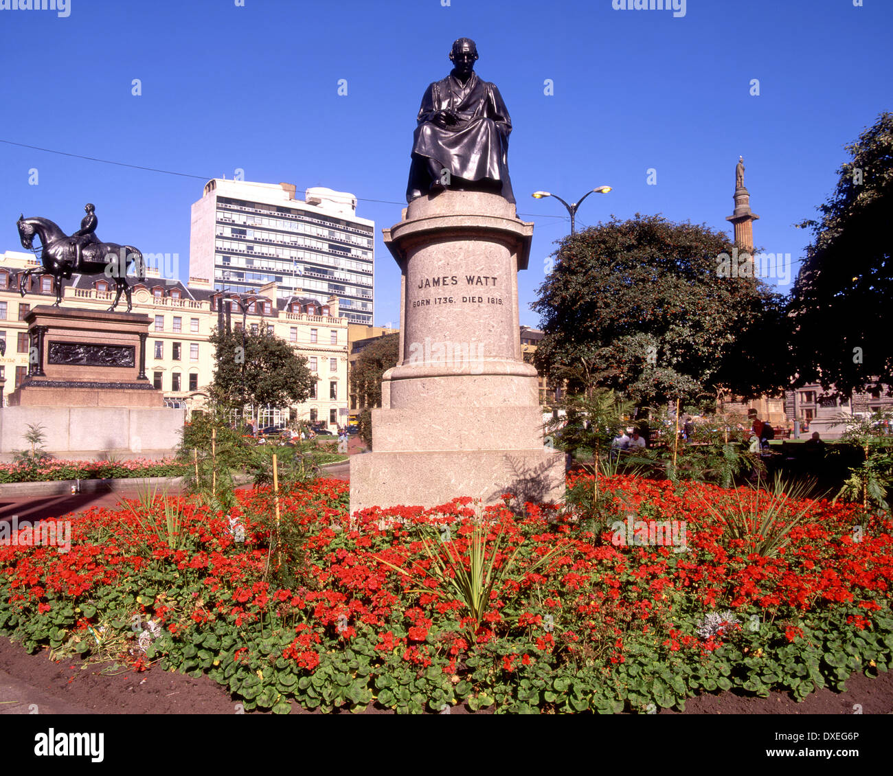 James watt statue in square glasgow and queen victoria statue