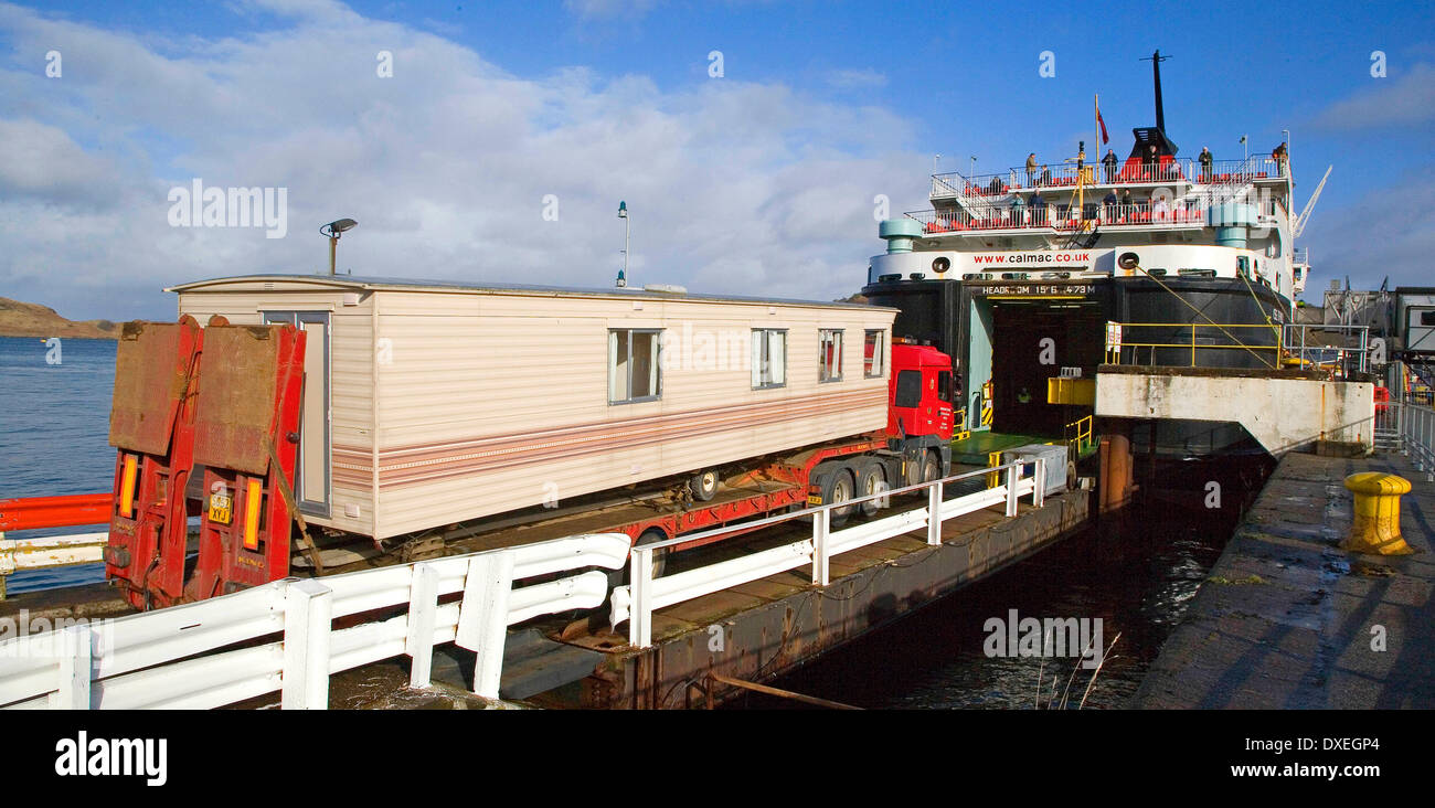 Large Caravan Transporter being loaded onto Mull Ferry. Stock Photo