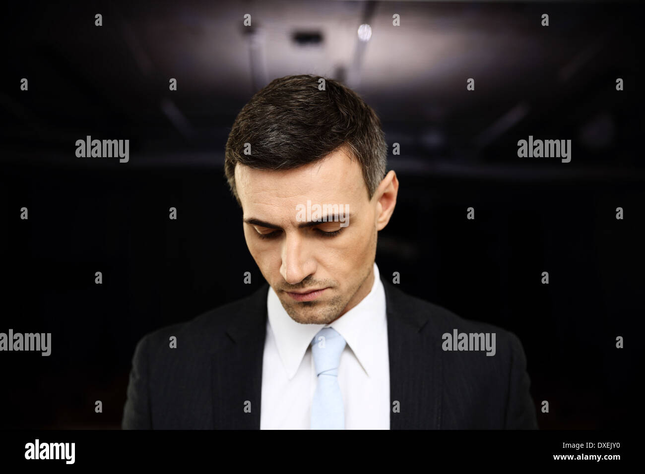 Serious thinking businessman workplace hi-res stock photography and ...