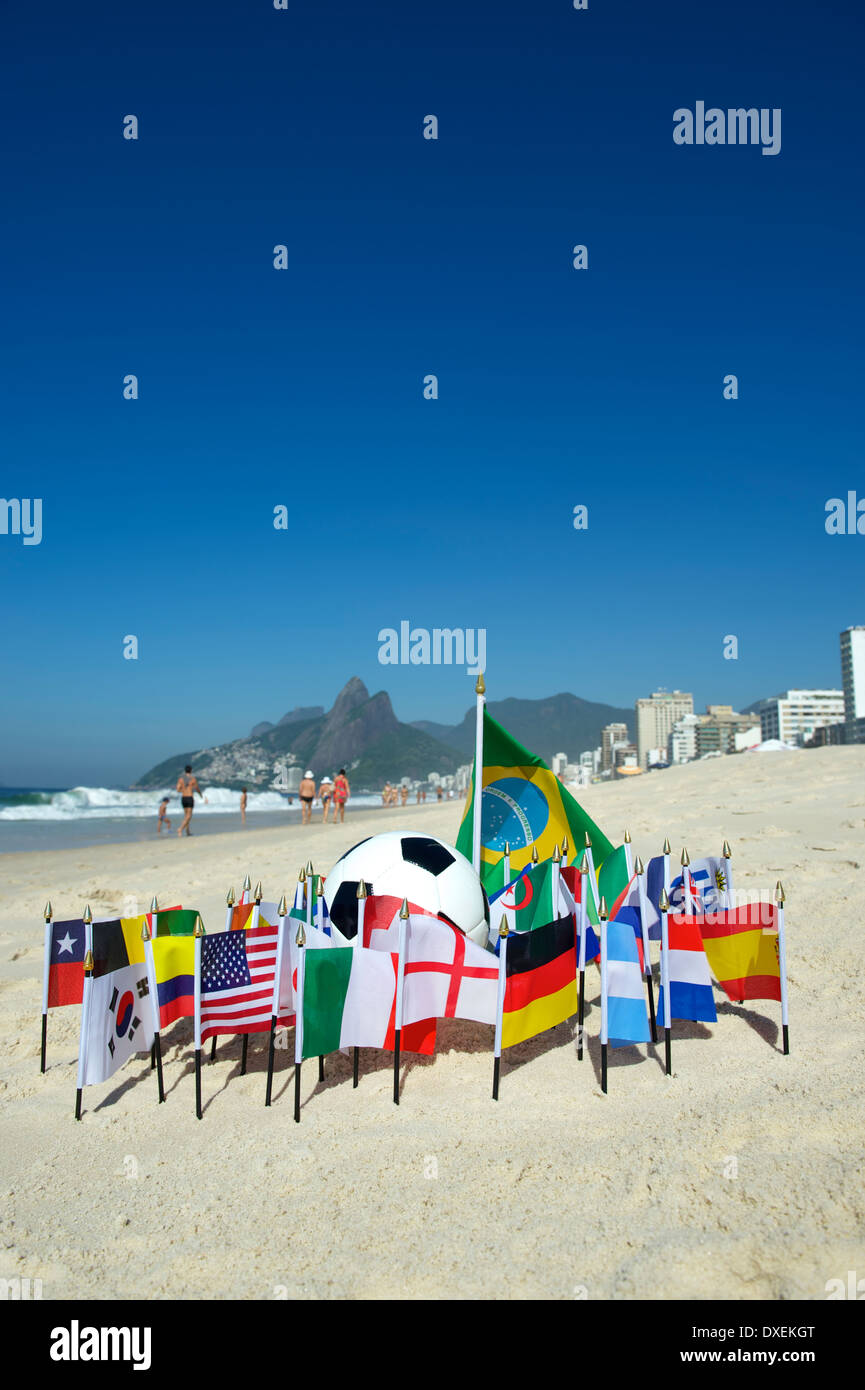 International football country flags with soccer ball on Ipanema beach in Rio de Janeiro Brazil Stock Photo