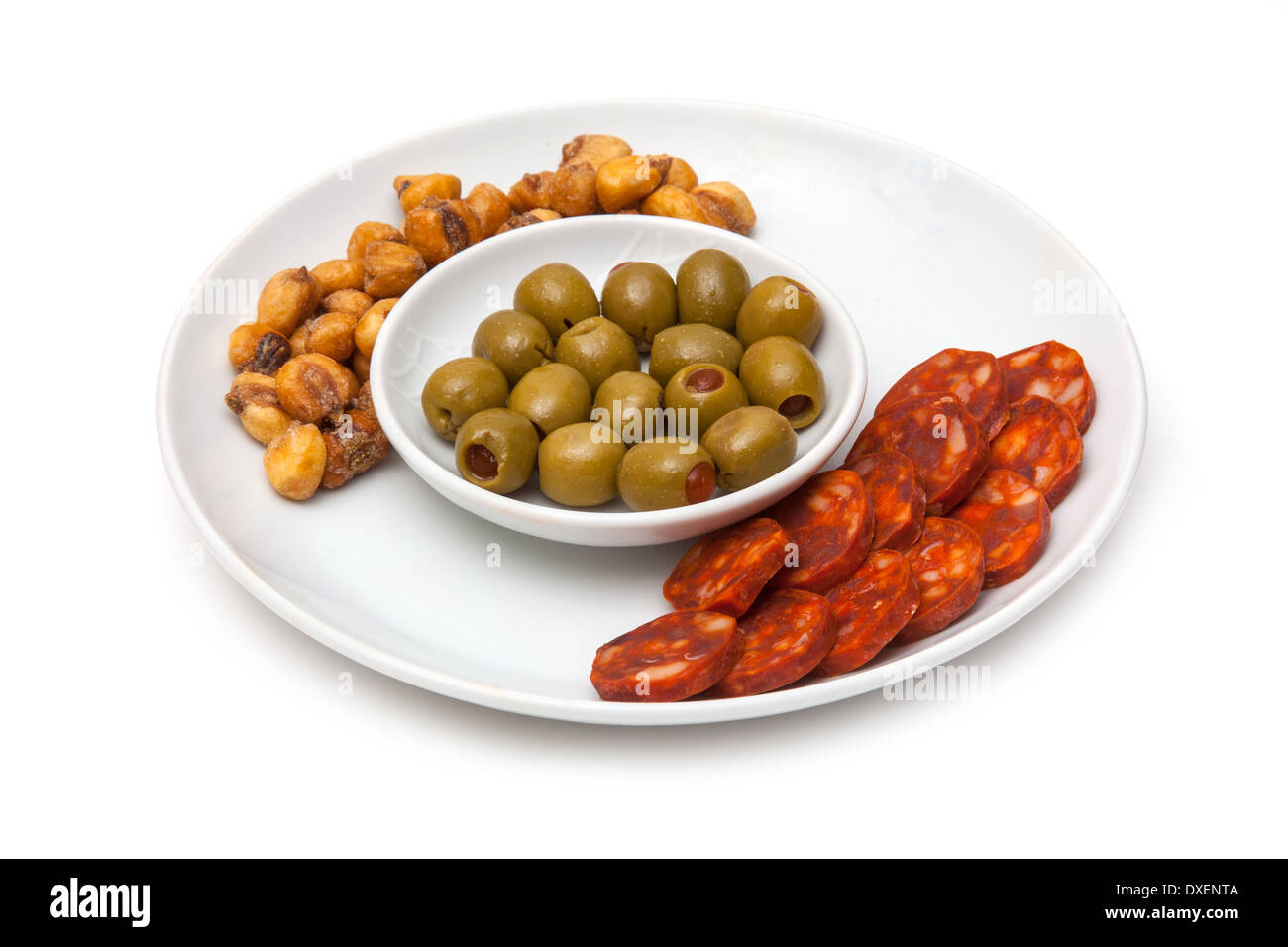 Plate of Spanish Tapas, Chorizo sausage, Salted Jumbo Corn, Pimento Stuffed Olives. Stock Photo