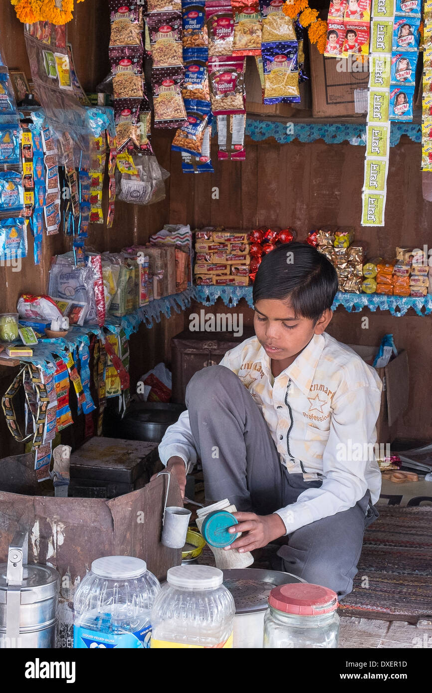 India, Uttar Pradesh, Agra, boy working in typical roadside tea shop
