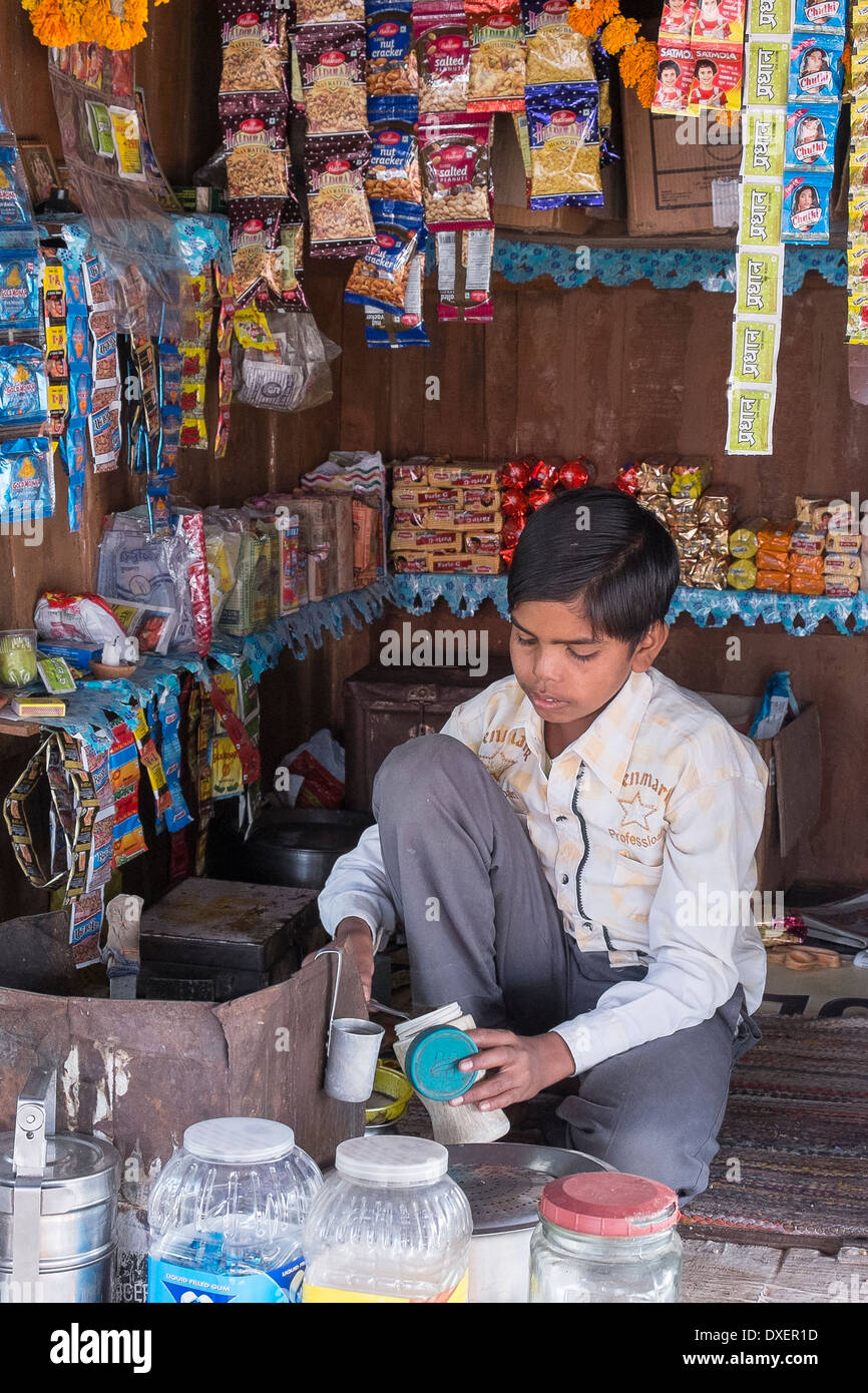 India, Uttar Pradesh, Agra, boy working in typical roadside tea shop Stock Photo