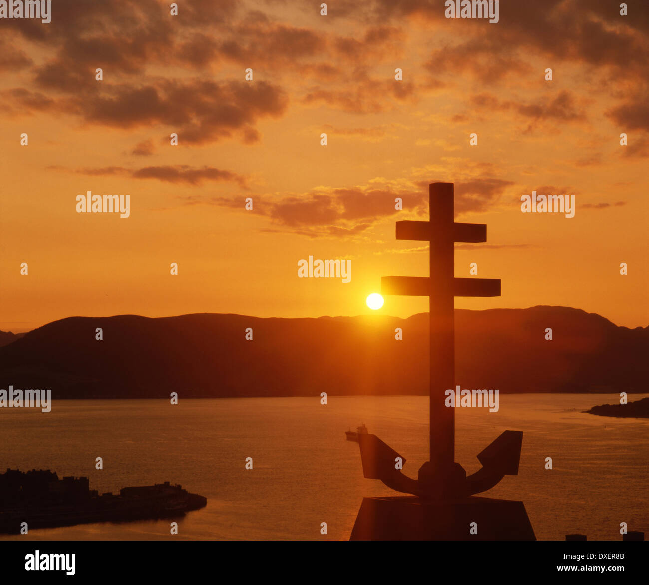 Sunset silhouette of the cross of Lorraine, The Free French memorial above Greenock, Clyde Stock Photo