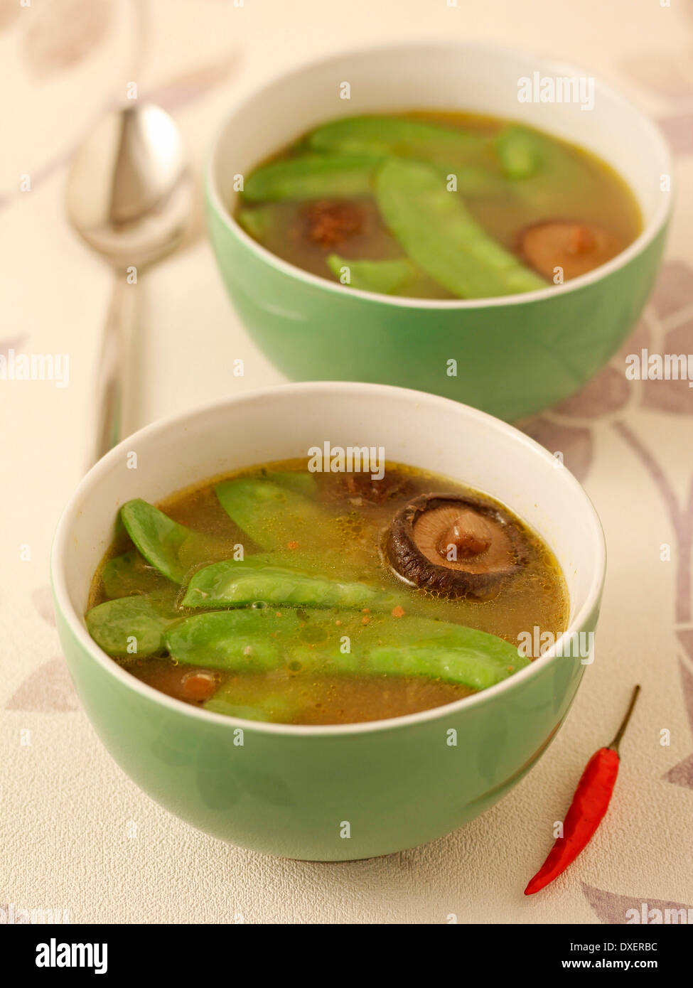 Mangetout soup with Chinese mushrooms. Recipe available Stock Photo Alamy