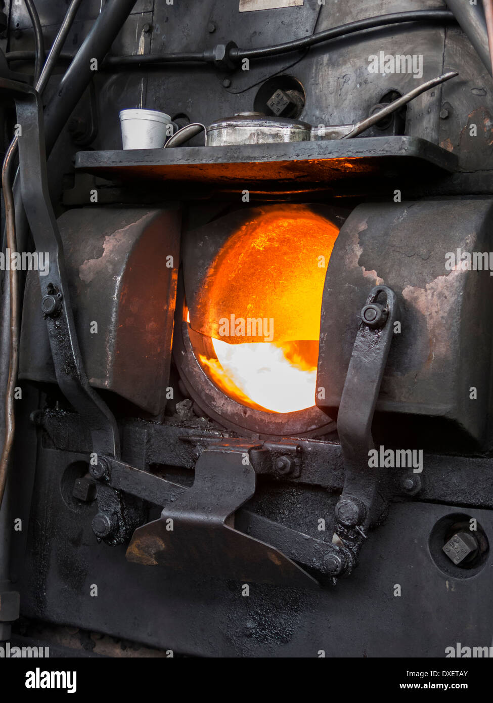 Steam train engine firebox glowing hot Norfolk England Stock Photo
