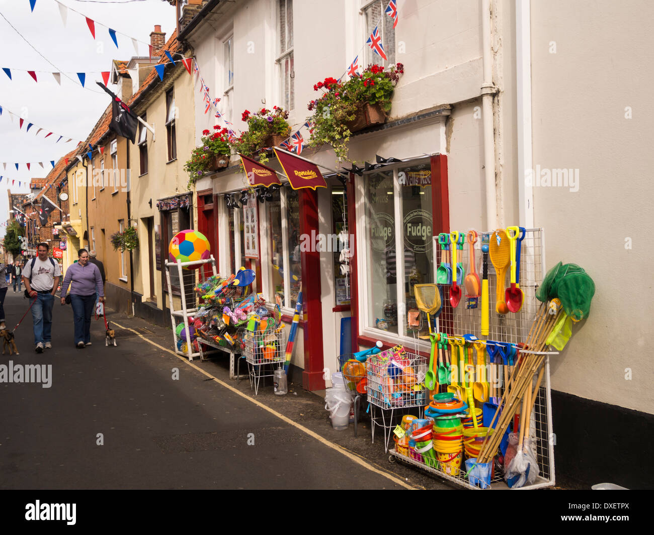 people standing in front of  seaside gift shop in Wells next the sea Norfolk England Stock Photo