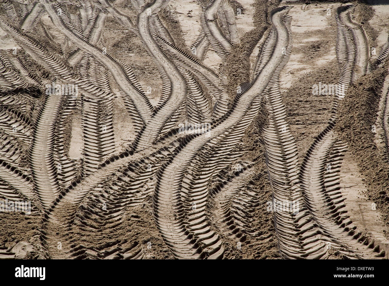 tyre tracks in the sand Stock Photo