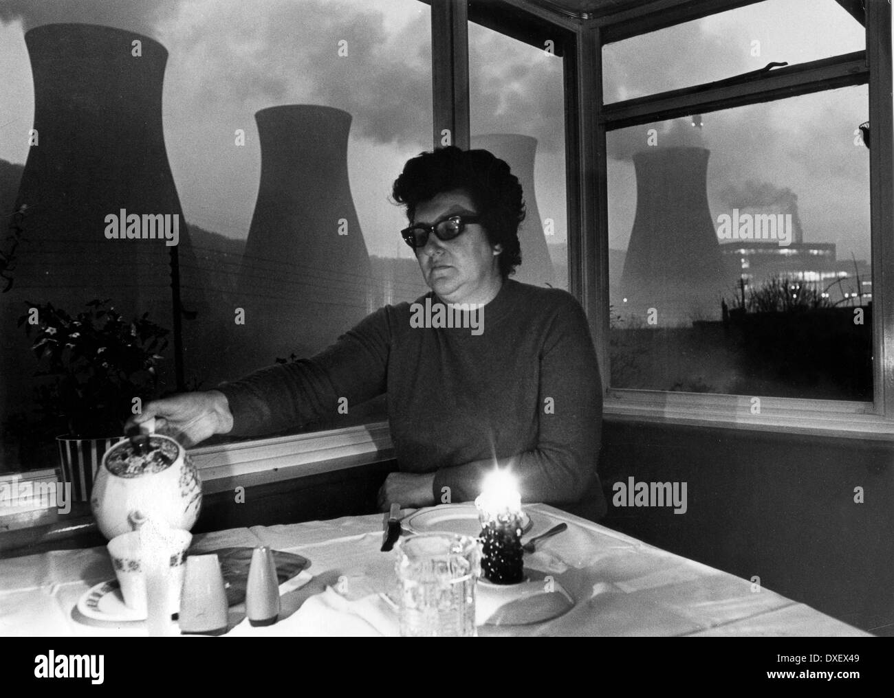 Woman living opposite Ironbridge Power Station eating by candlelight during 1972 electricity power cuts Uk PICTURE BY DAVID BAGNALL Stock Photo