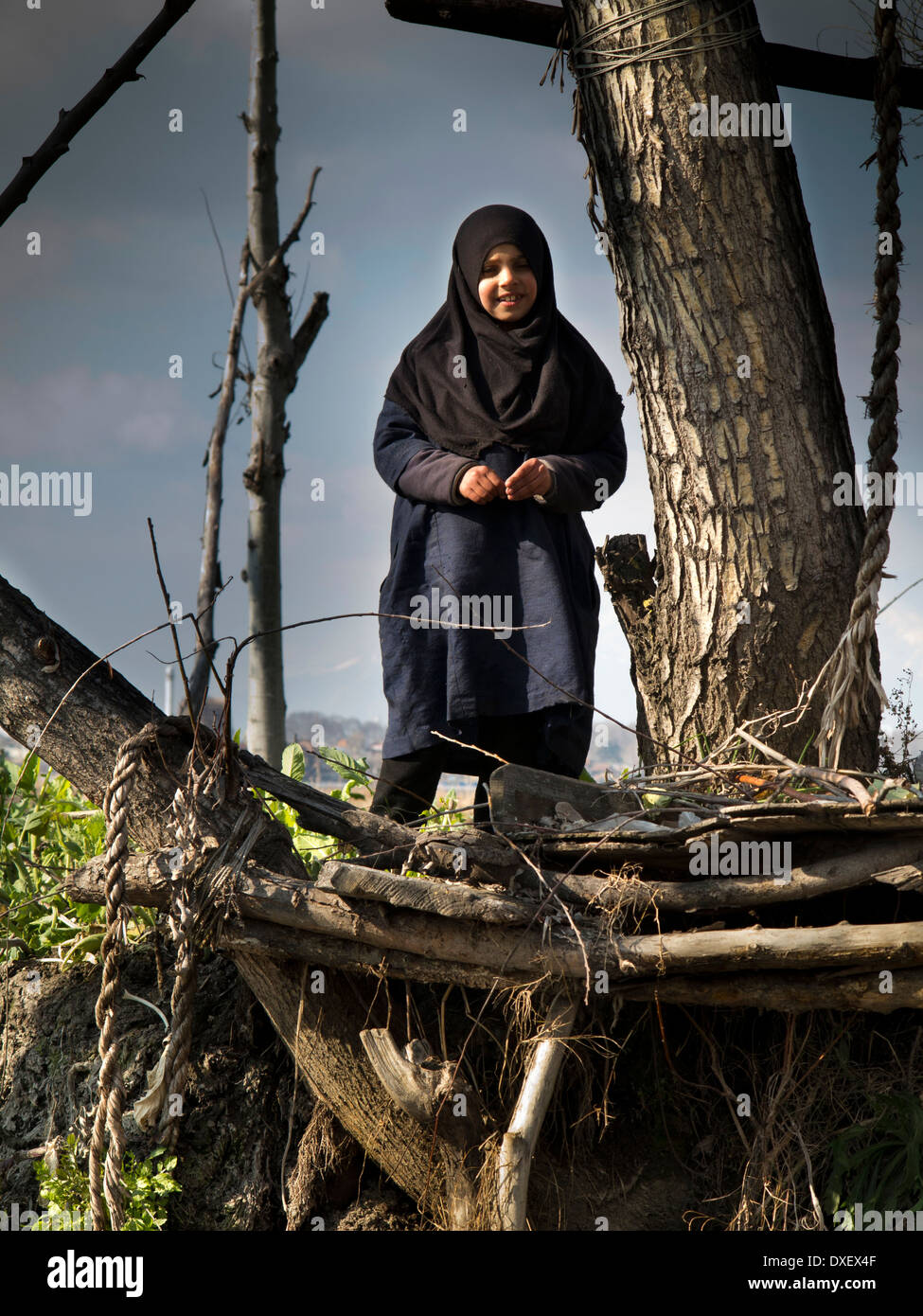 India, Kashmir, Srinagar, Nishar Suth village young Moslem girl on floating garden Stock Photo