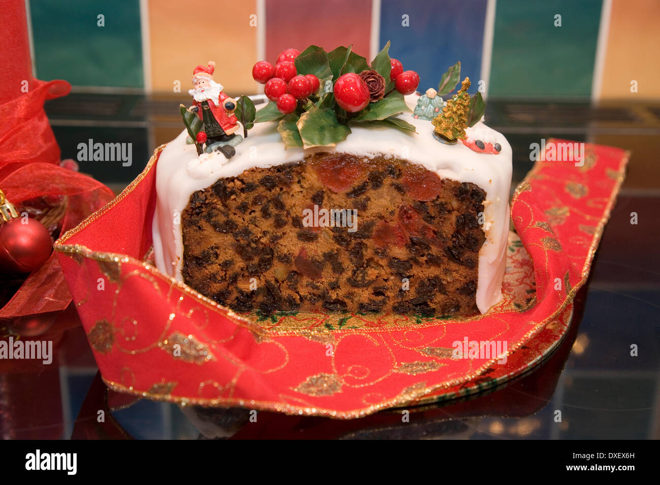 Home made christmas cake with icing and decorations. Stock Photo