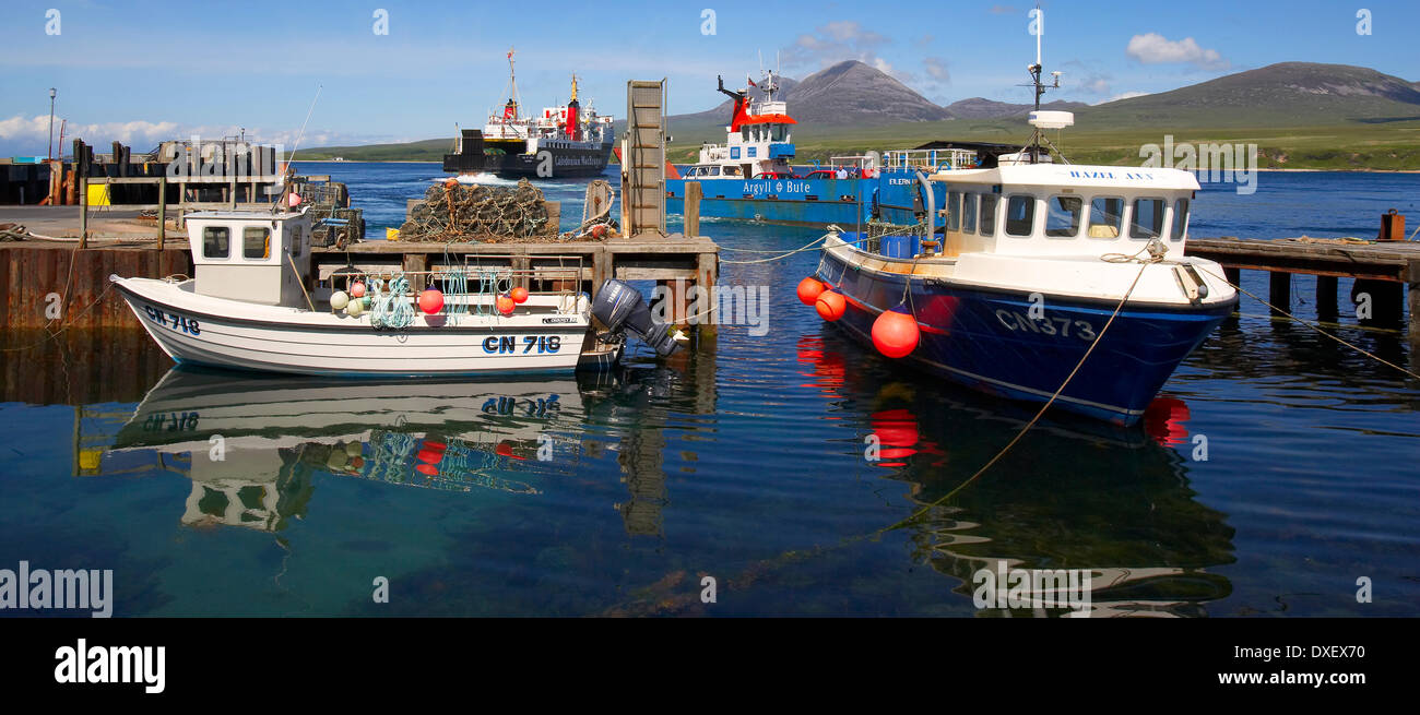 The M.V.Isle of Arran departing Port Askaig on Islay with the Paps of Jura in view, Argyll Stock Photo